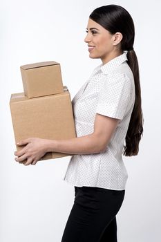 Image of a woman carrying stack of carton boxes 
