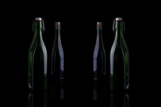 Wine bottle, still life profile, isolated on black background