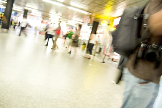 Hurrying crowd of people in the subway corridor. Abstract picture. color version.