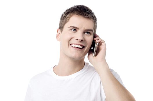Young handsome man talking on cell phone