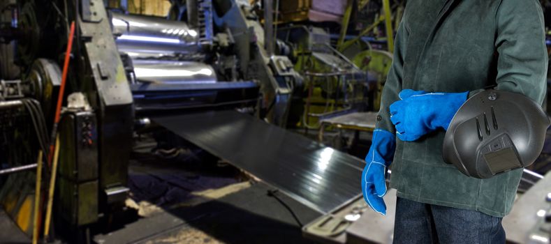 Worker with instruments at industrial factory