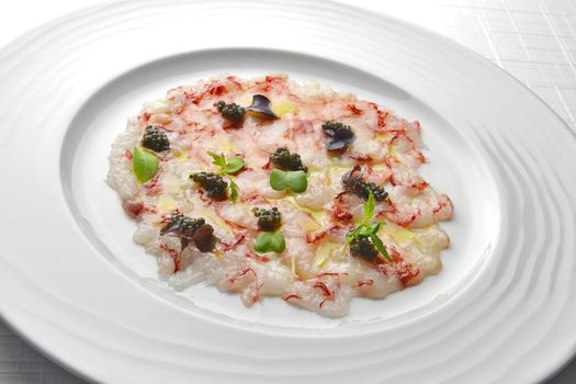 Fish Appetizer Carpaccio of Red Prawns and Caviar in white round plate