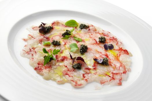 Fish Appetizer Carpaccio of Red Prawns and Caviar in white round plate