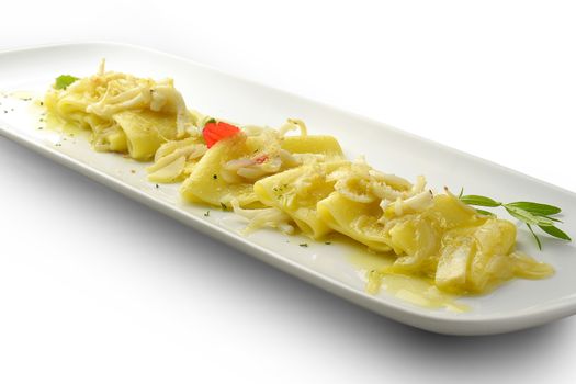 Pasta Dish Paccheri Macaroni with Onion and Squid in white long plate