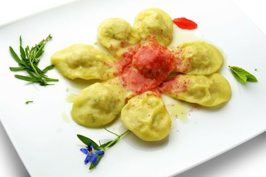 Pasta Dish Ravioli Stuffed with Shellfish and Sauce Wild Berries in square white plate