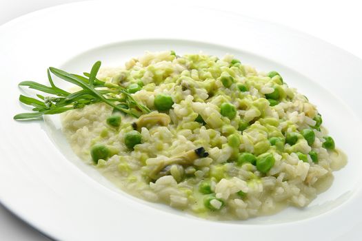 Plate of Risotto with Clams and Peas in white plate