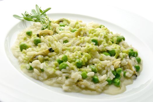 Plate of Risotto with Clams and Peas in white plate