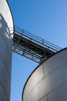 Grain silos set against a blue sky.