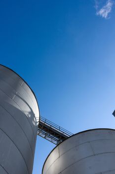 Silos set against a blue sky.