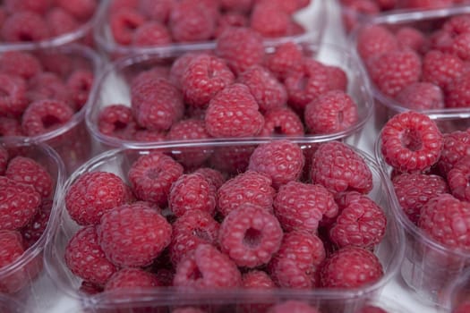 Fresh juicy raspberry on the market.