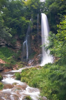 Gostilje Waterfall on mountain Zlatibor. Mist forming around the waterfall