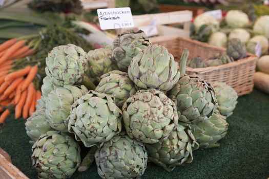 Fresh fruits artichokes at the farmers market.