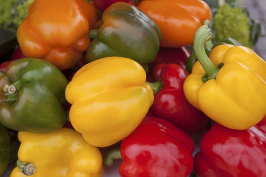 Colorful sweet bell peppers, at the market natural background.