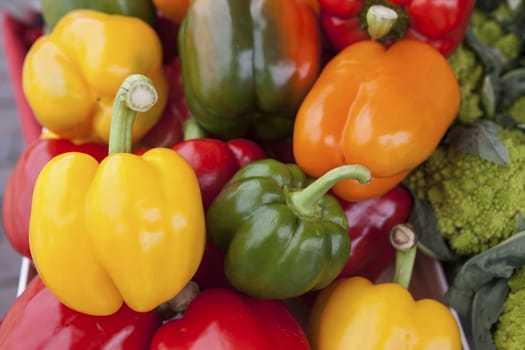 Colorful sweet bell peppers, at the market natural background.