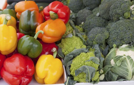 Fresh sweet peppers and Brussels sproutsat the market natural background.