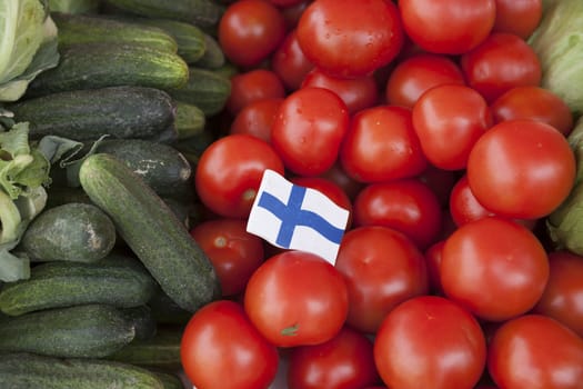 Fresh vegetables on the market cucumbers, tomatoes at the farmers market in Finland.