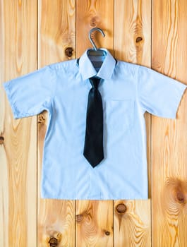 Children's shirt with short sleeves and tie top view