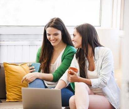 Female friends studying at the local coffee shop