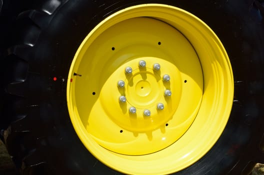 Large Black and Yellow tractor wheel