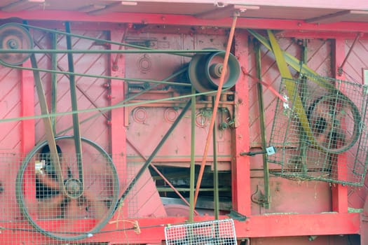 Side of Old Threshing Machine with belts