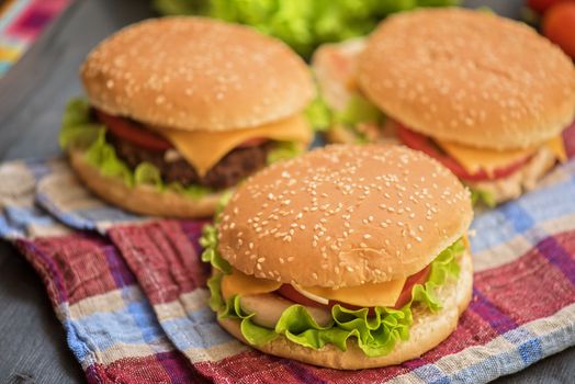 Closeup of home made burgers on wooden table