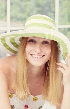Beautiful woman wearing hat. Studio fashion portrait. toning