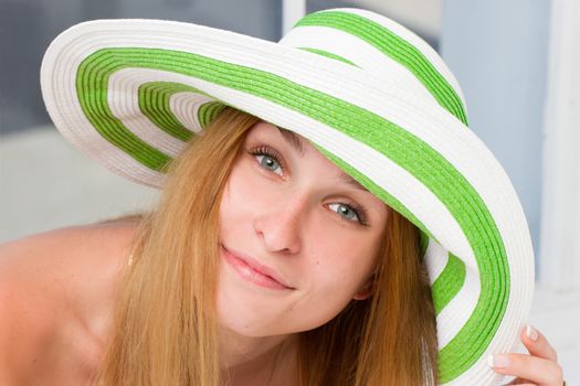 Beautiful woman wearing hat. a Studio portrait.