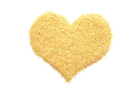 Bulgur wheat in a heart shape, isolated on a white background