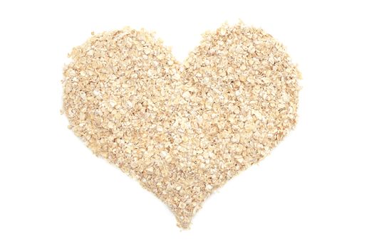Porridge oats in a heart shape, isolated on a white background