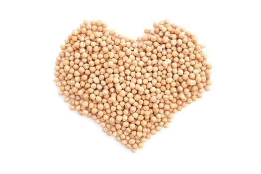 Dried chick peas in a heart shape, isolated on a white background