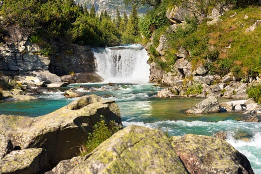 Waterfall in summer, Chiese River, in the National Park of Adamello Brenta, Val di Fumo. Trentino Alto Adige, Italy