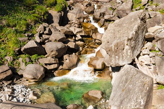 Detail of water flowing over the rocks. Long time exposure