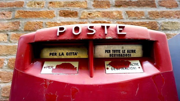 close up red postal box public in Venice, Italy