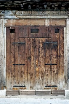 charming old wooden door house building in Venice, Italy