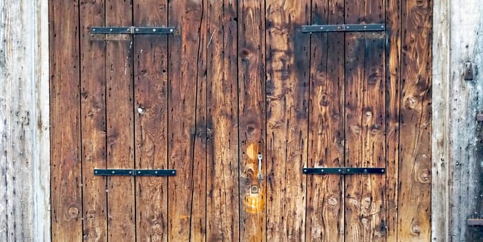 close up charming old wooden door house building in Venice, Italy
