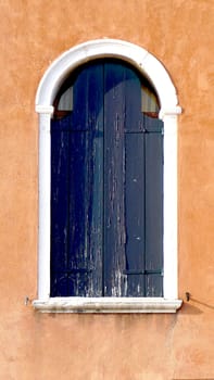 close up Windows on orange brown wall building architecture, Venice, Italy