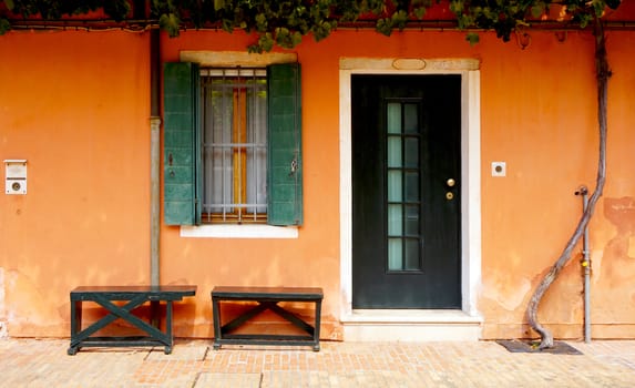 door and window in front of house building in Venice, Italy
