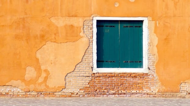 green Window on yellow and brick wall building architecture, Venice, Italy