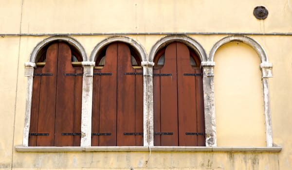 three windows and blank one in Venice, Italy