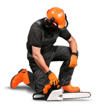 Professional logger resting with chain saw, safety gear on