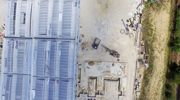 Building construction site, overhead view.