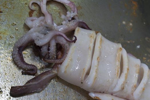 squid on frying pan