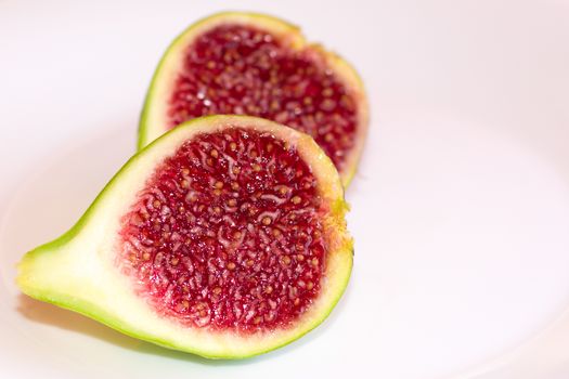 One mature fig cut in two halves.