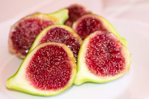 Three very mature figs cut in halves.