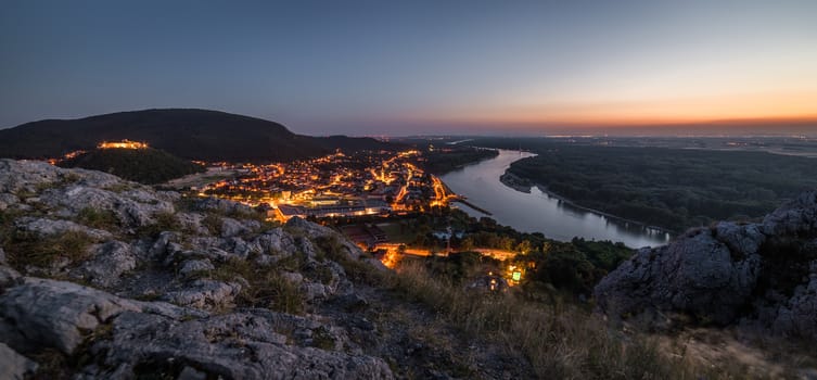 View of Lit Small City of Hainburg an der Donau with Danube River as Seen from Braunsberg Hill at Beautiful Sunset