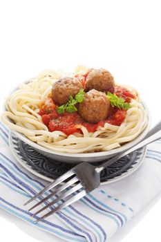 Pasta with tomato sauce and meatballs. Traditional mediterranean eating. 