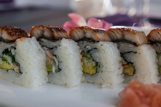 set of sushi rolls served with wasabi and ginger







sushi rolls with wasabi and ginger closeup