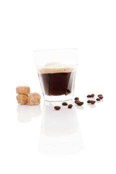 Delicious espresso with coffee beans and brown crane sugar isolated on white background. Traditional coffee drinking. 