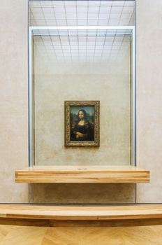 Paris, France - May 13, 2015: Leonardo DaVinci's "Mona Lisa" at the Louvre Museum, May 13, 2015 in Paris, France. The painting is one of the world's most famous.