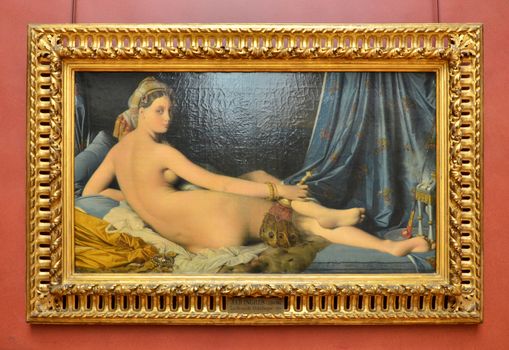 Paris, France - May 13, 2015: Grande Odalisque, also known as Une Odalisque or La Grande Odalisque, is an oil painting of 1814 by Jean Auguste Dominique Ingres. The work is displayed in the Louvre.